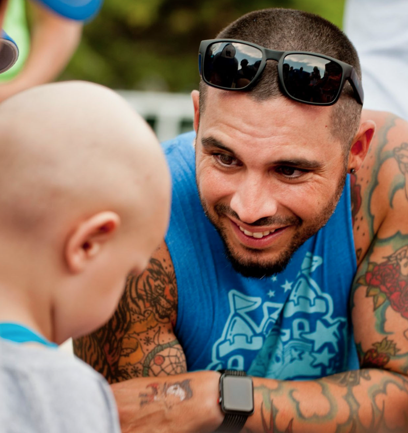Manny Munoz with a child — founder and CEO of Gamerosity